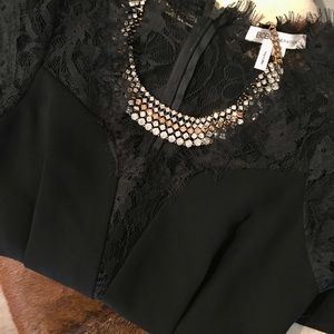 Adorable little black dress with lace detail!